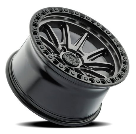 Jeep wheel rim with metallic finish on a white background