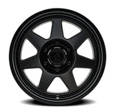 Black alloy wheel on a white background