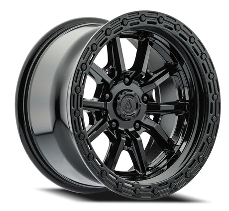 Black alloy wheel with a detailed rim design on a white background