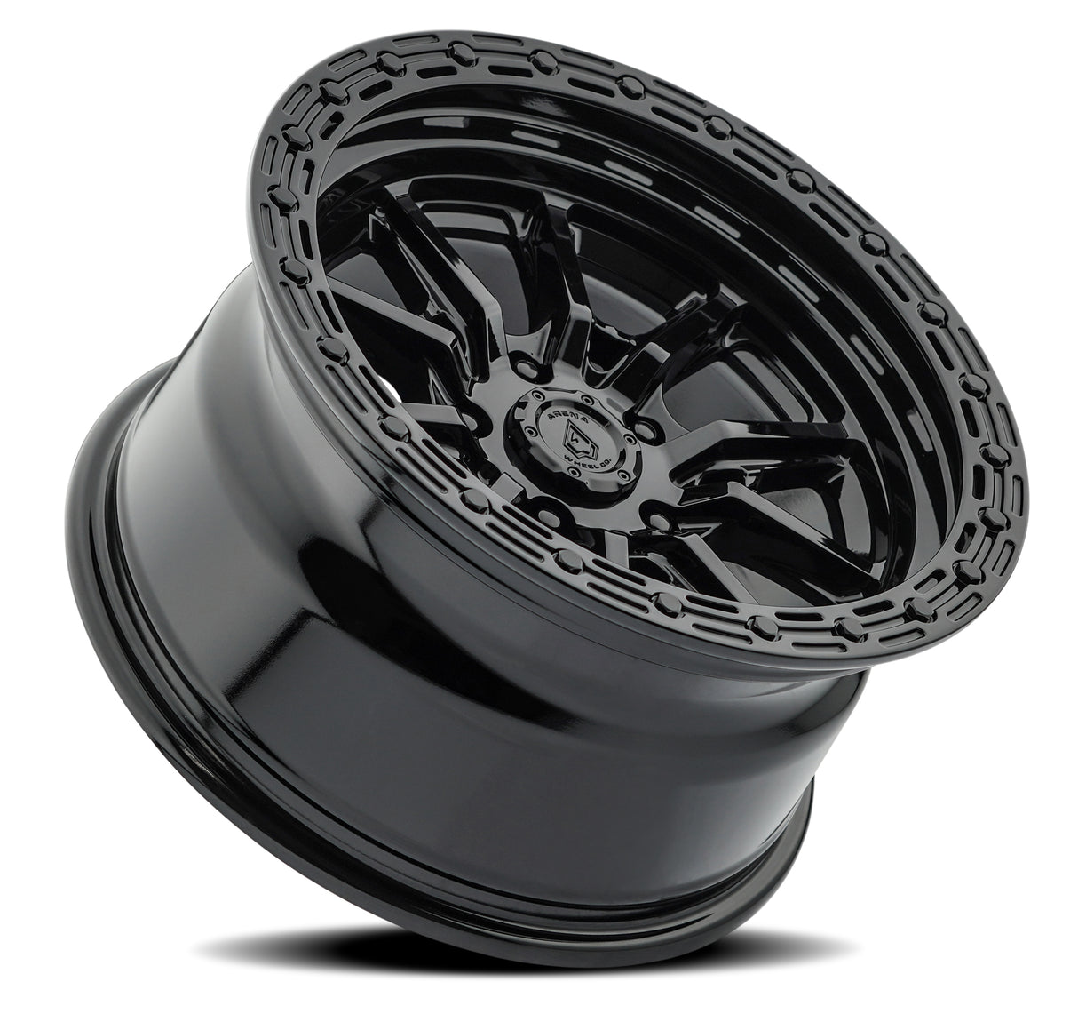 Black alloy wheel with detailed design on a white background