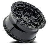 Black alloy wheel with detailed design on a white background