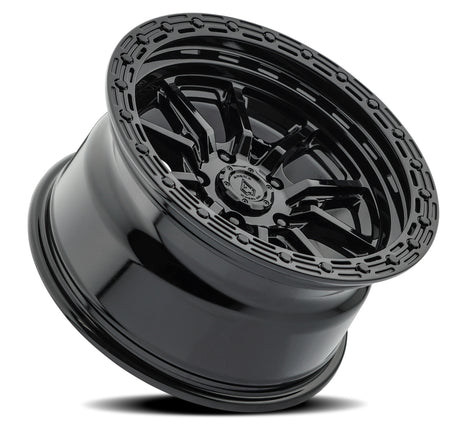 Black alloy wheel with detailed design on a white background