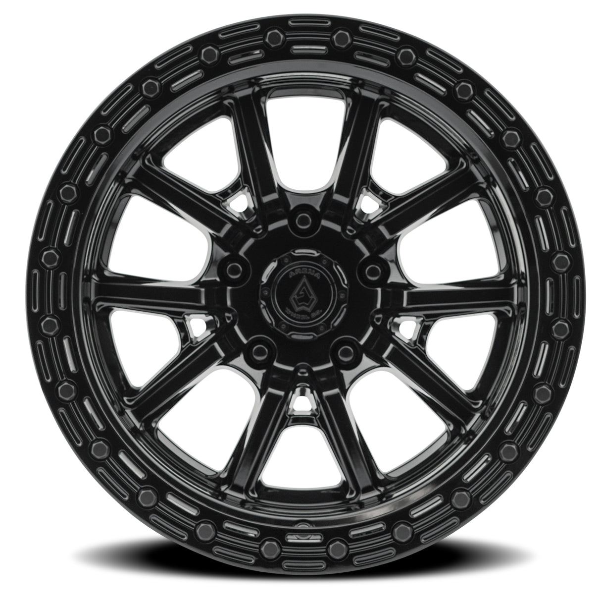 Black alloy wheel with a detailed rim design on a white background