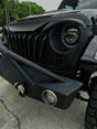 Close-up of a black off-road vehicle's front bumper and grille. Jeep Wrangler and Jeep Gladiator Front Grille.