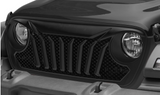 Close-up of a vehicle's grille and headlights with a black finish.